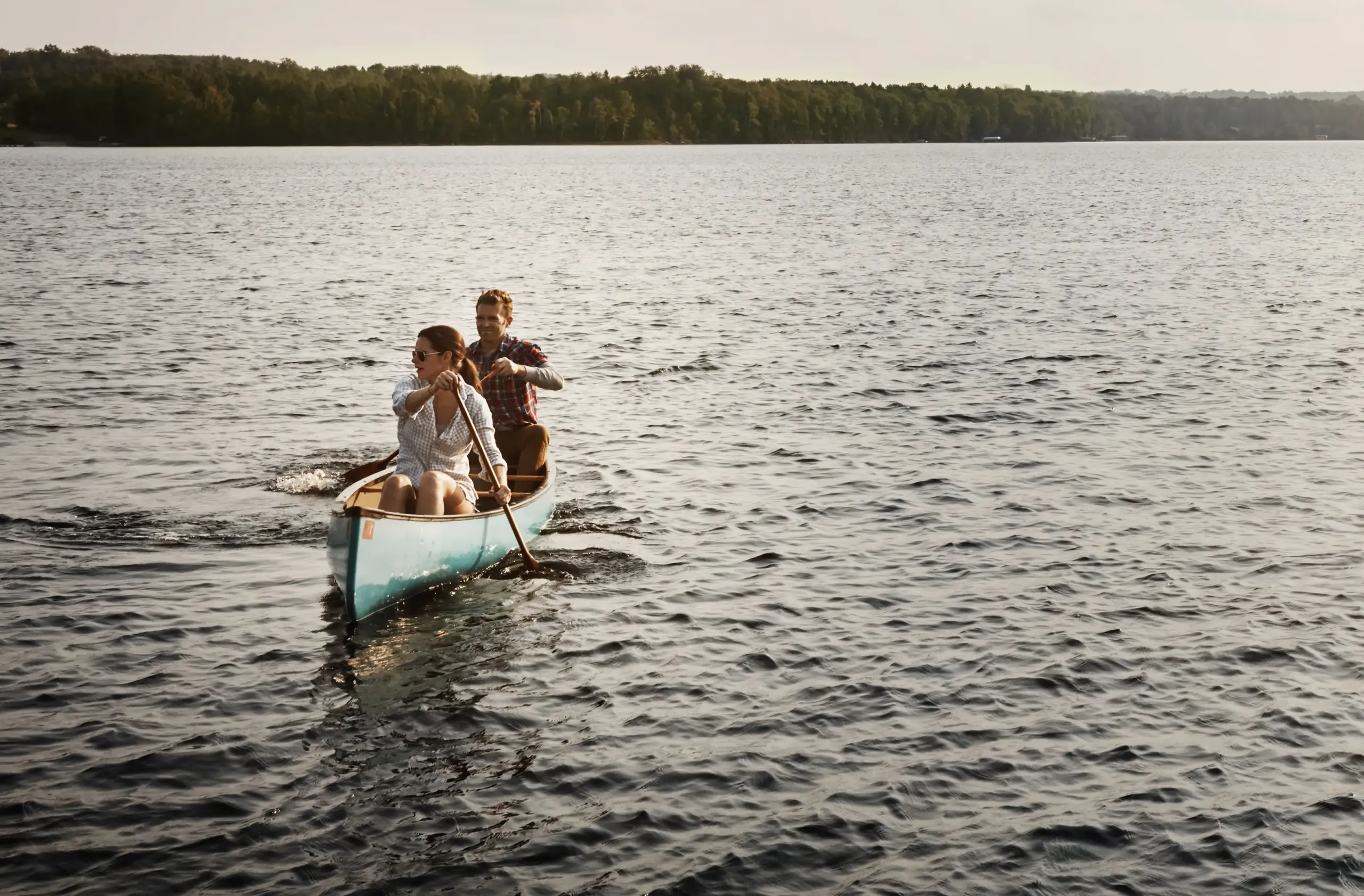 HGH-Hormone-Clinic A couple takes a canoe out on a lake. Get HGH hormone therapy from Kane Lai, MD in Dallas-Fort Worth Metroplex.