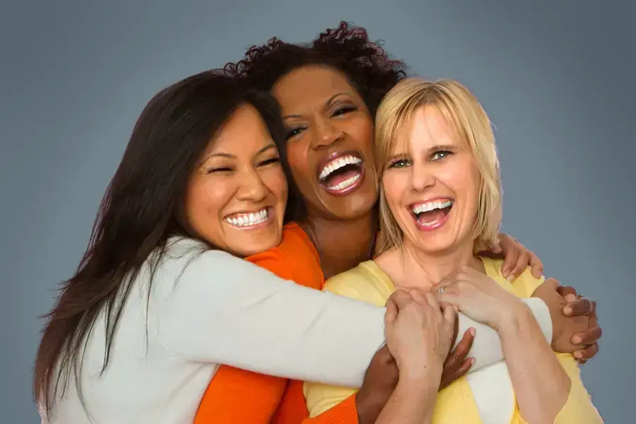 Insulin-Resistance-Clinic An asian, black, and white woman of middle age hug and laugh. Get insulin resistance treatment from Kane Lai, MD in Dallas-Fort Worth Metroplex.